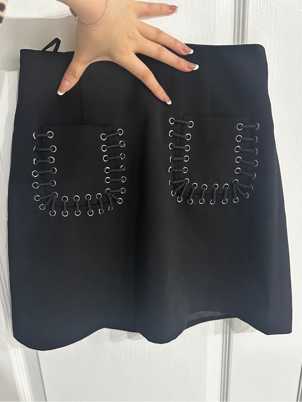 Black Mini Skirt with Eyelet-Laced Pockets